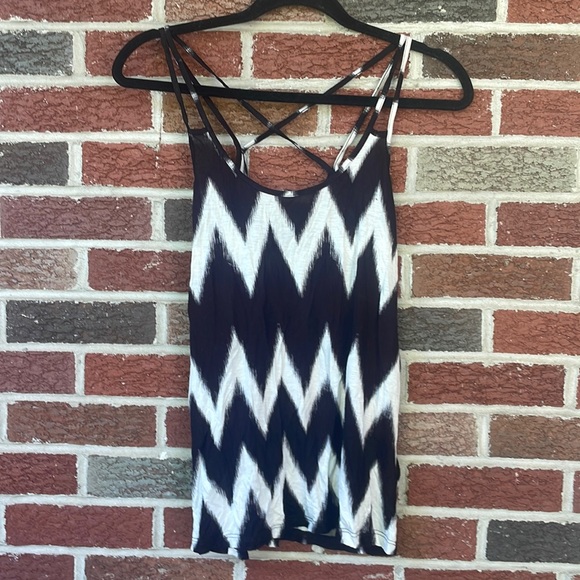 H&M Tops - Brand new H&M tank top. Spaghetti straps, crisscross in the back. Small.